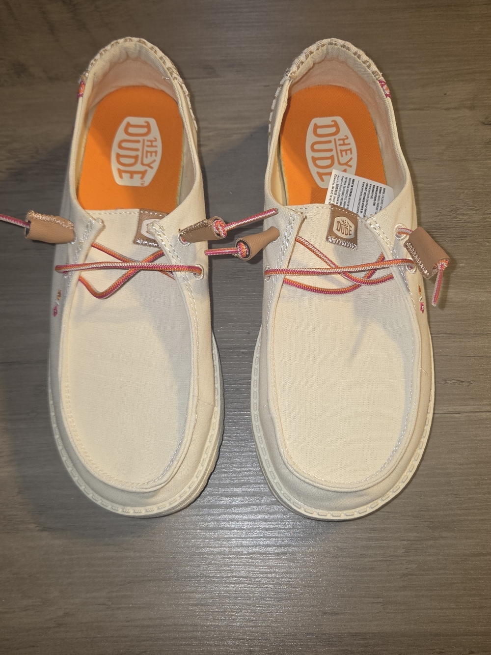 Hey Dude Women’s Cream Canvas Slip-Ons with Coral Laces and Orange Insoles